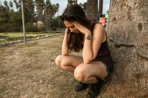 A woman considering the psychological impacts of combining Adderall with intermittent fasting while balancing her mental health and wellness.