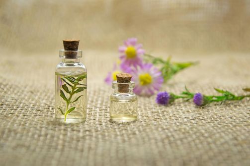 A woman using essential oils for weight loss, including peppermint, grapefruit, and lavender, as part of her healthy lifestyle.