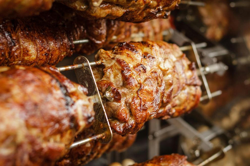 A variety of grilles meats on a cutting board