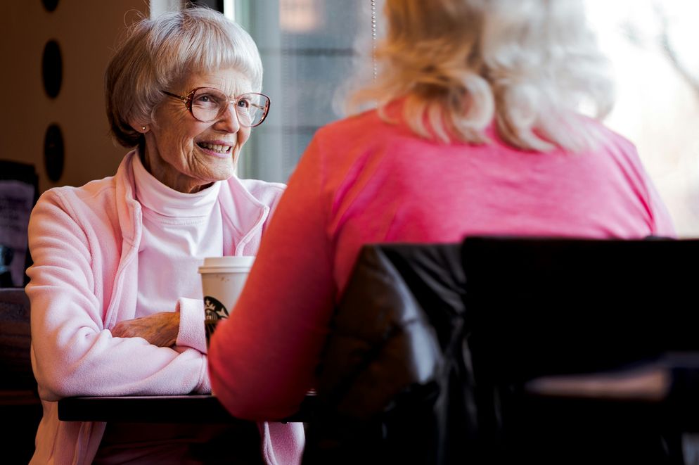 Two older women happily discussing the carnivore diet