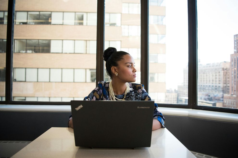 A woman using CBT techniques to manage career-related stress, balancing work responsibilities and self-care.