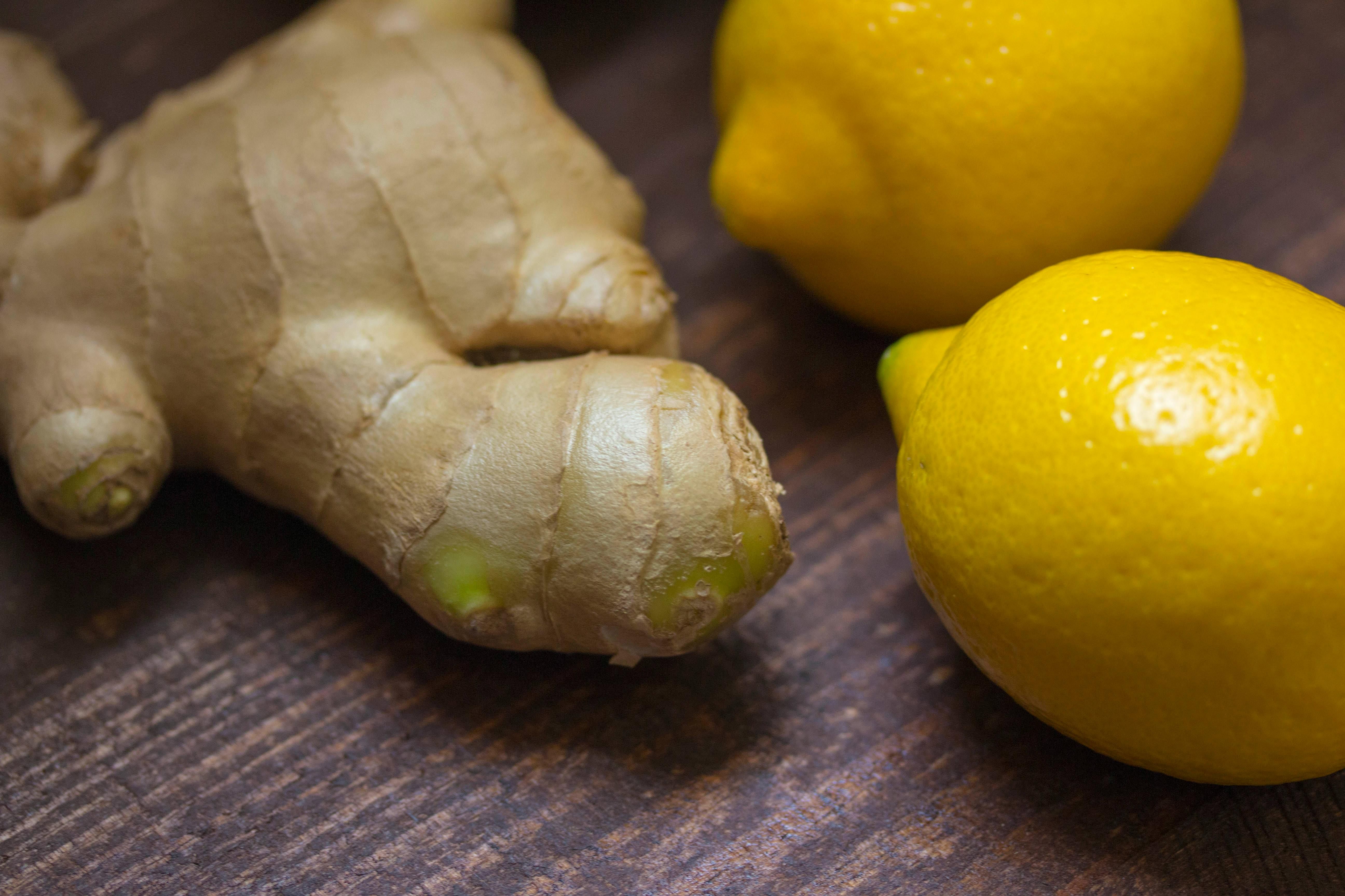 Sliced ginger and lemon ready for infused water, offering immune-boosting and anti-inflammatory benefits for a healthy drink.