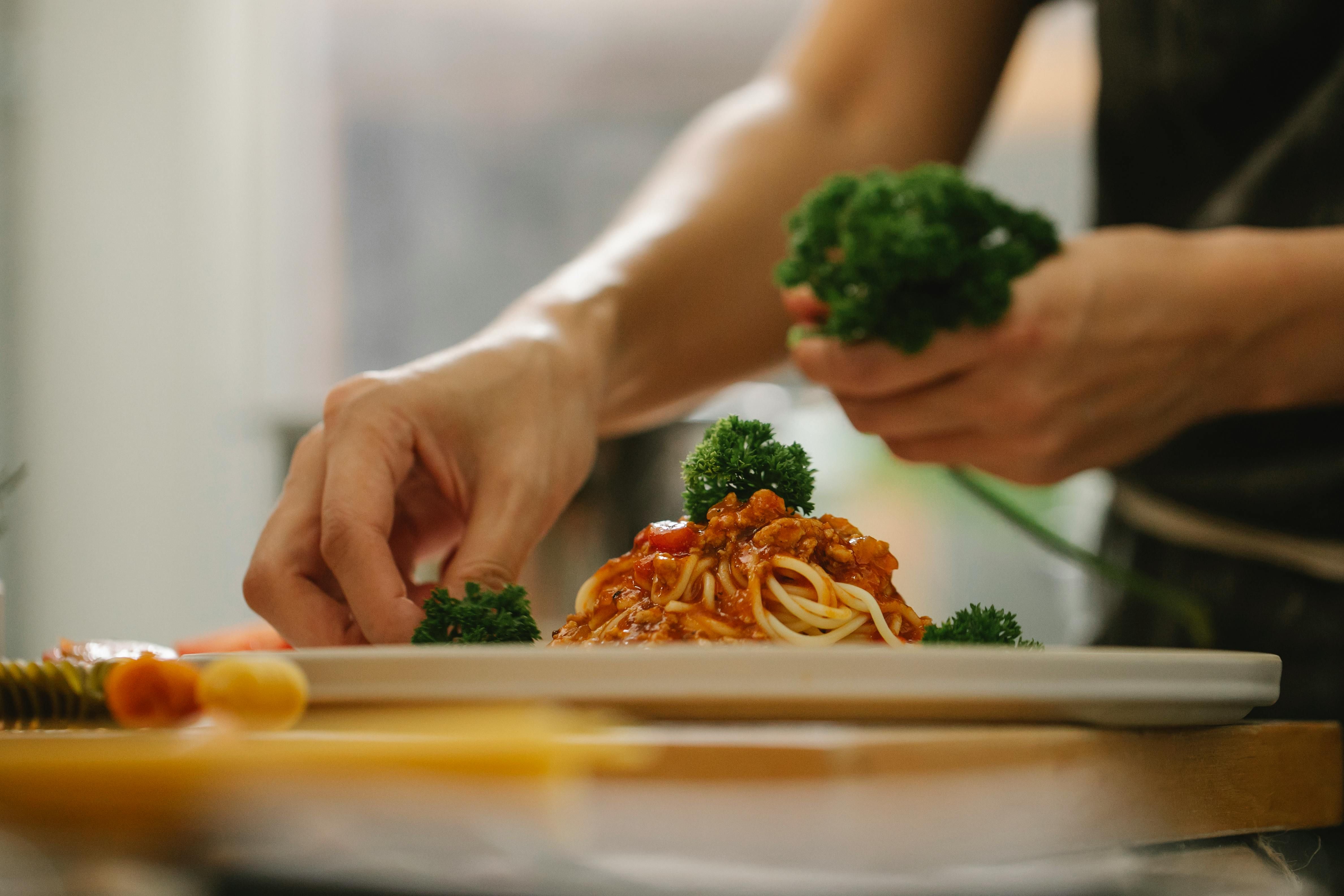 An Italian woman cooking a traditional dish, showcasing the Mediterranean diet's role in promoting health and longevity in Sardinia, a Blue Zone region.