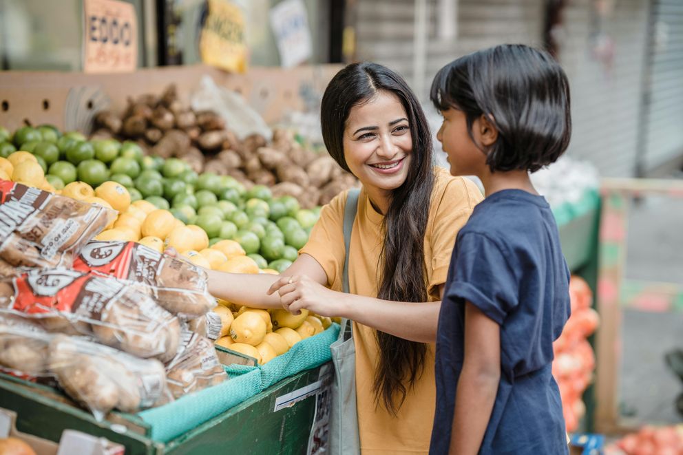 A woman considering the potential disadvantages of the MIND diet, reflecting on her dietary choices.