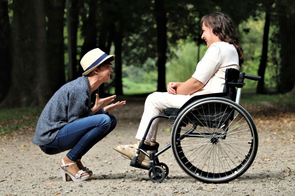 A woman using accessible exercises and healthy eating strategies to support weight loss despite mobility challenges.