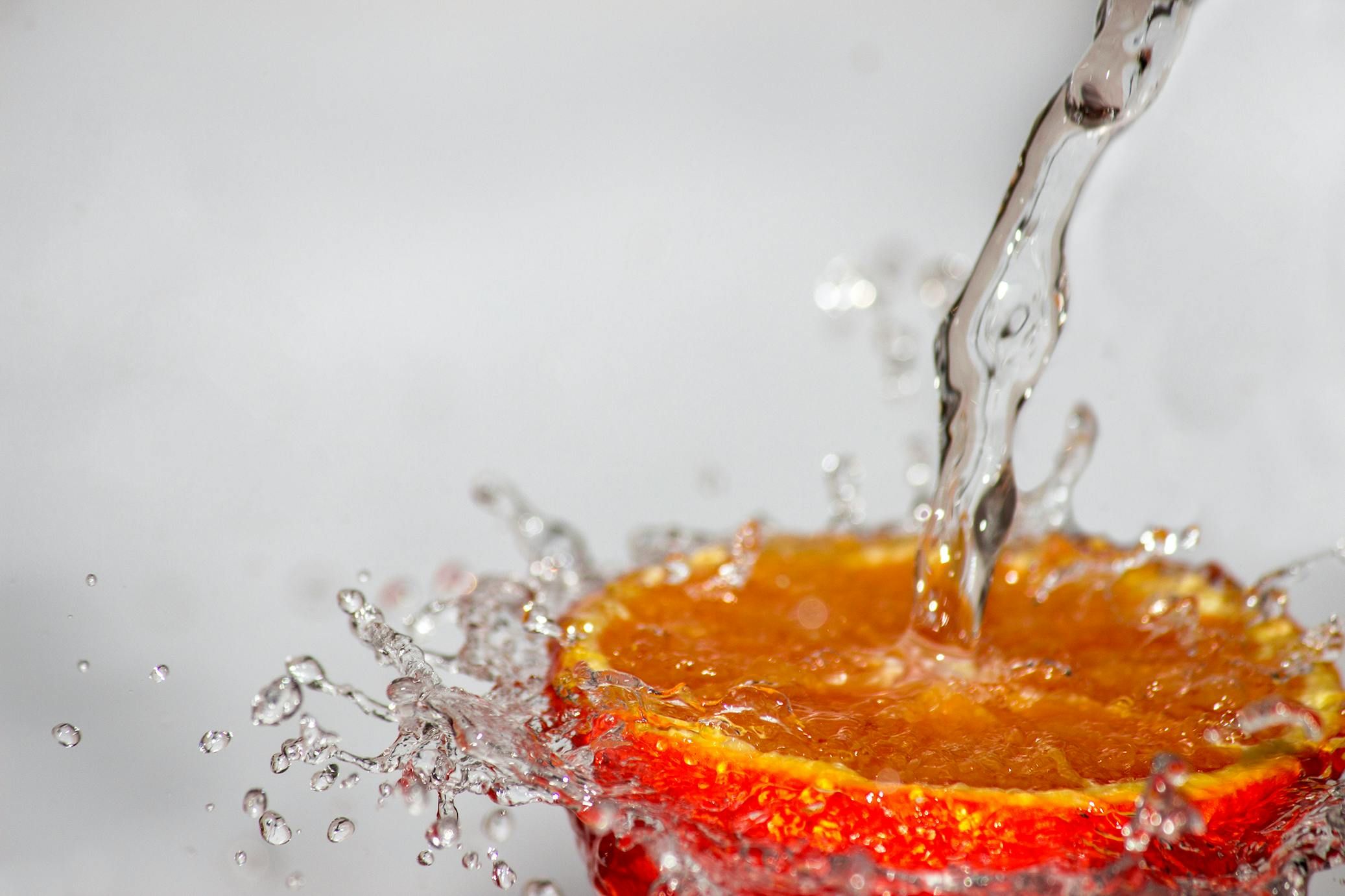 Sliced oranges ready for infused water, offering a boost of vitamin C and refreshing citrus flavor for hydration.