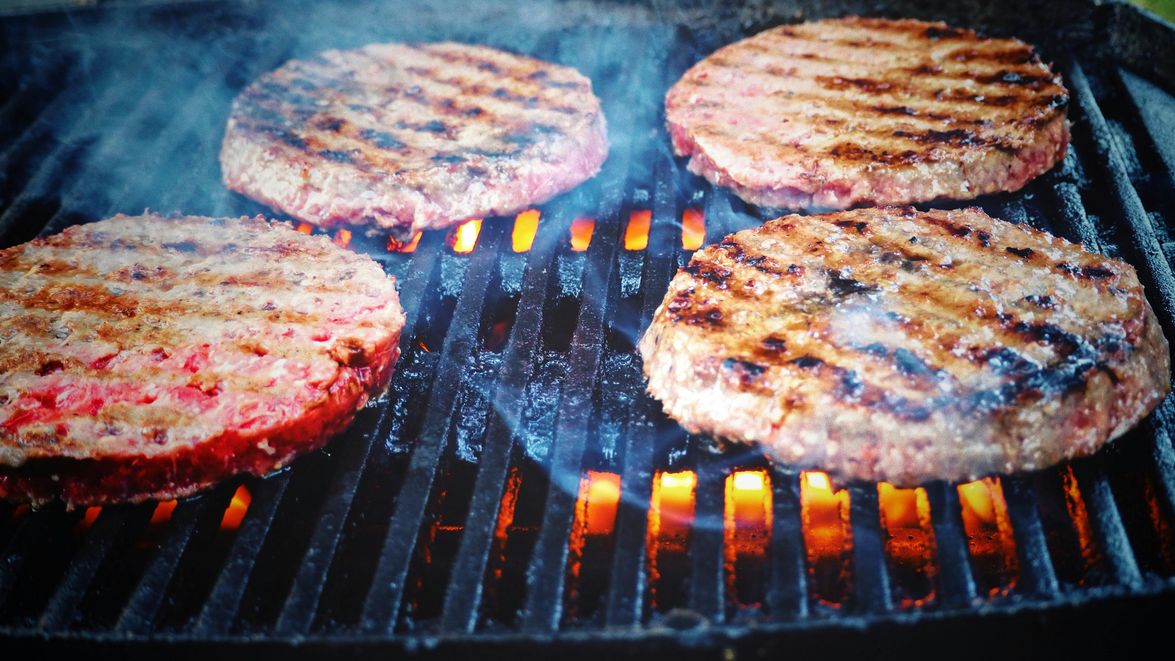 A woman enjoying seasonal variations of meat on the carnivore diet, embracing nutrient-rich cuts for optimal health.