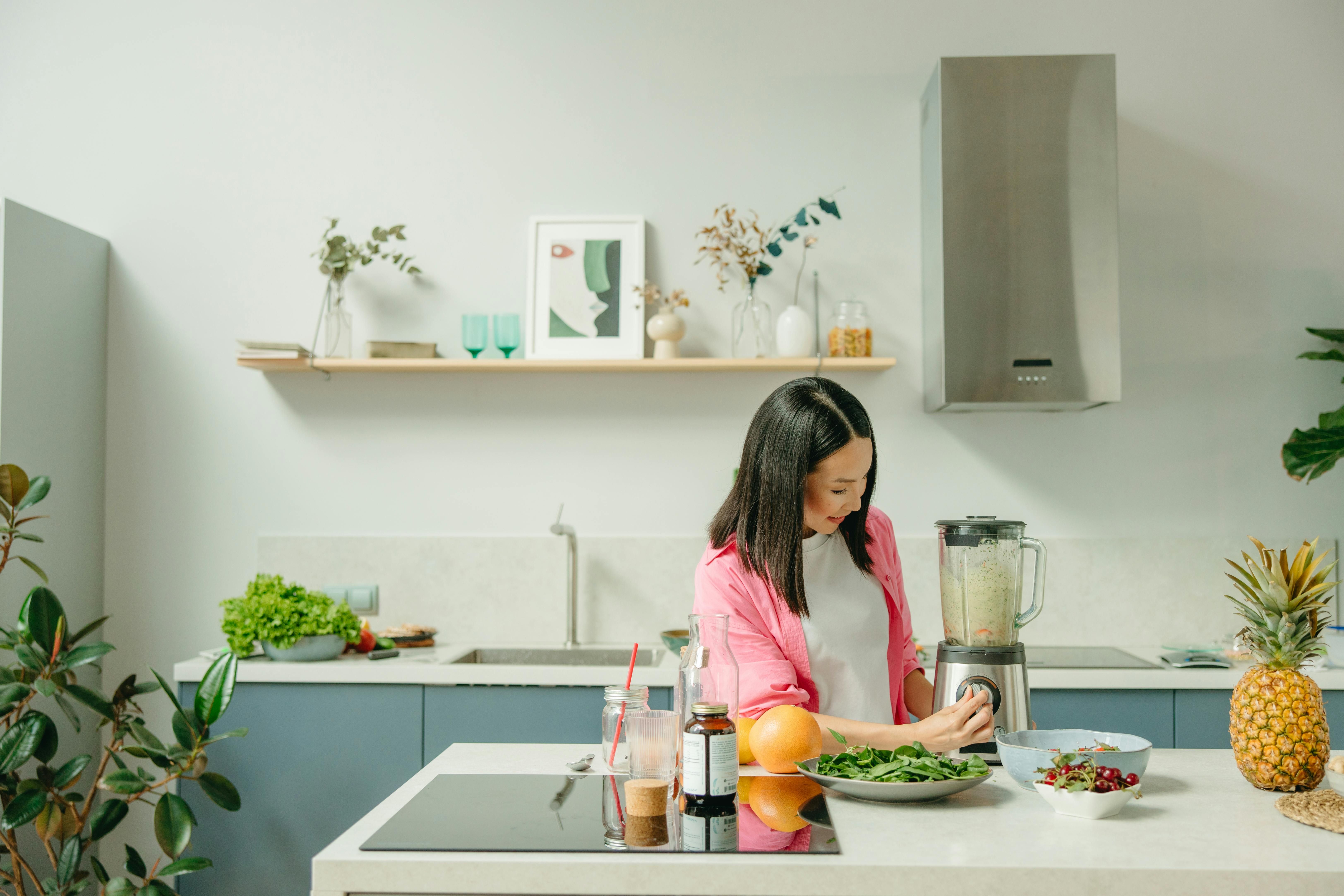 A woman cooking a brain-boosting meal from the MIND diet, focusing on fresh vegetables and whole grains.