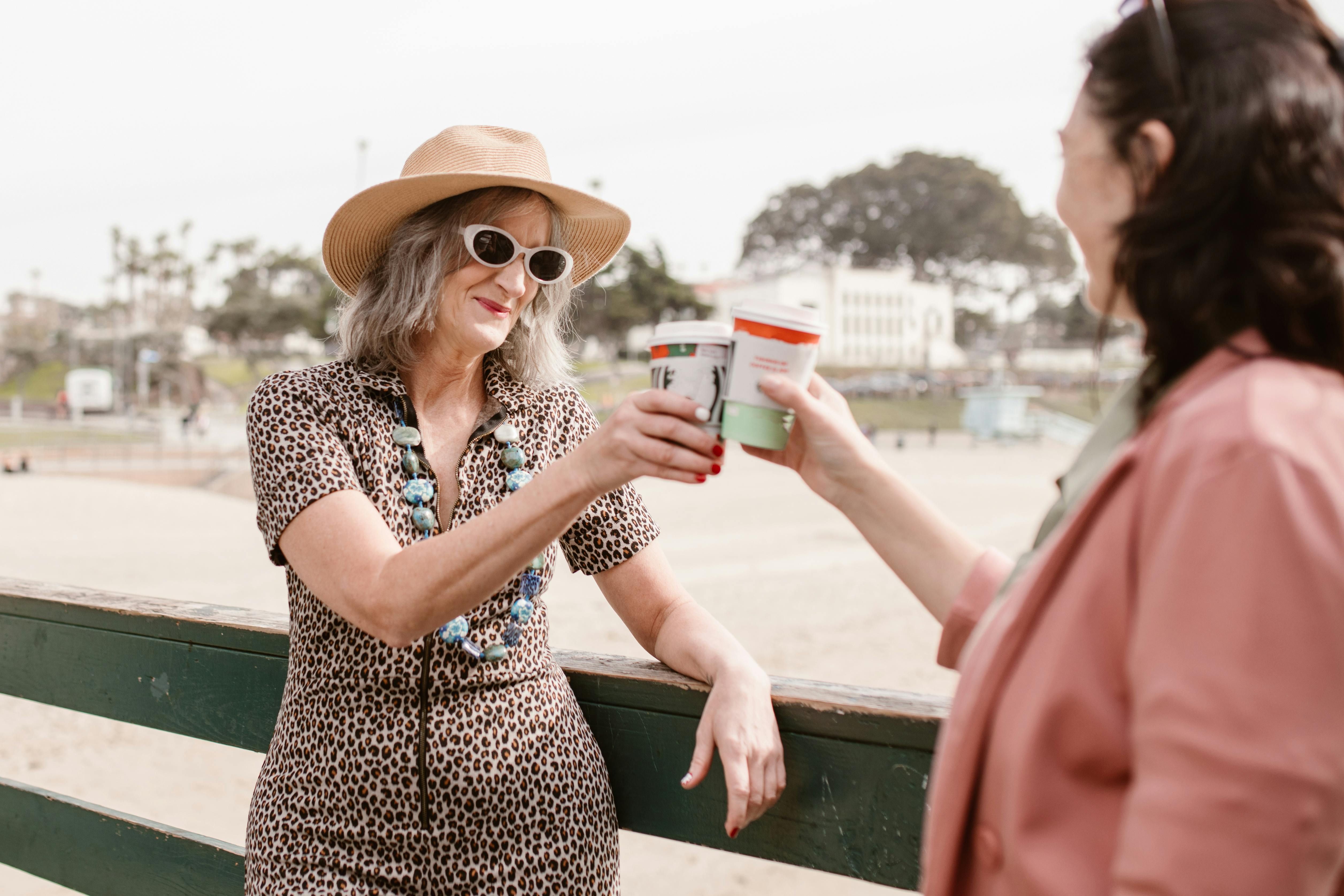 Women of different ages enjoying coffee together, highlighting the social and wellness benefits of shared moments across generations.