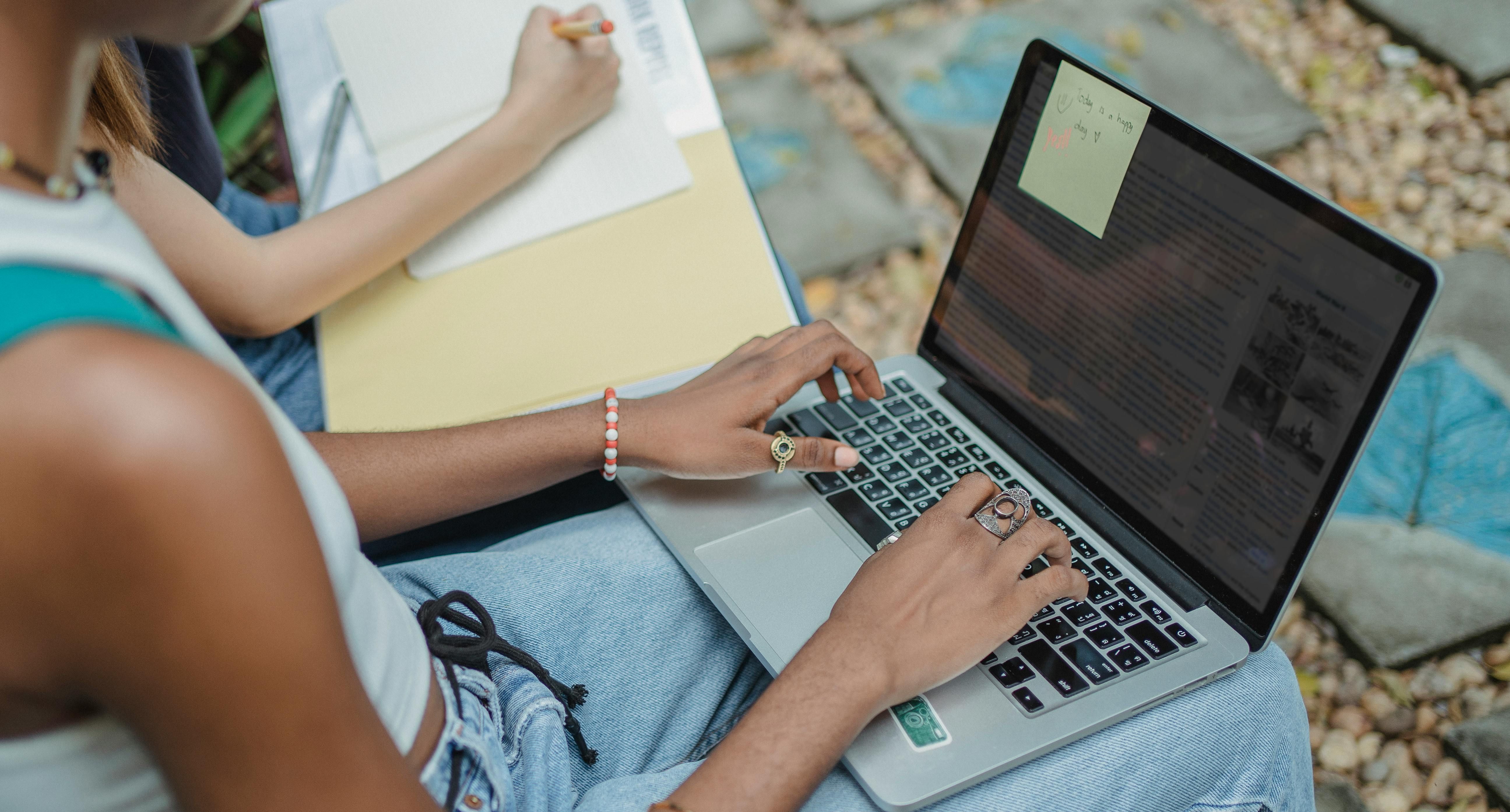 A woman studying and engaging her brain in learning, supported by quality sleep to enhance memory and cognitive function.