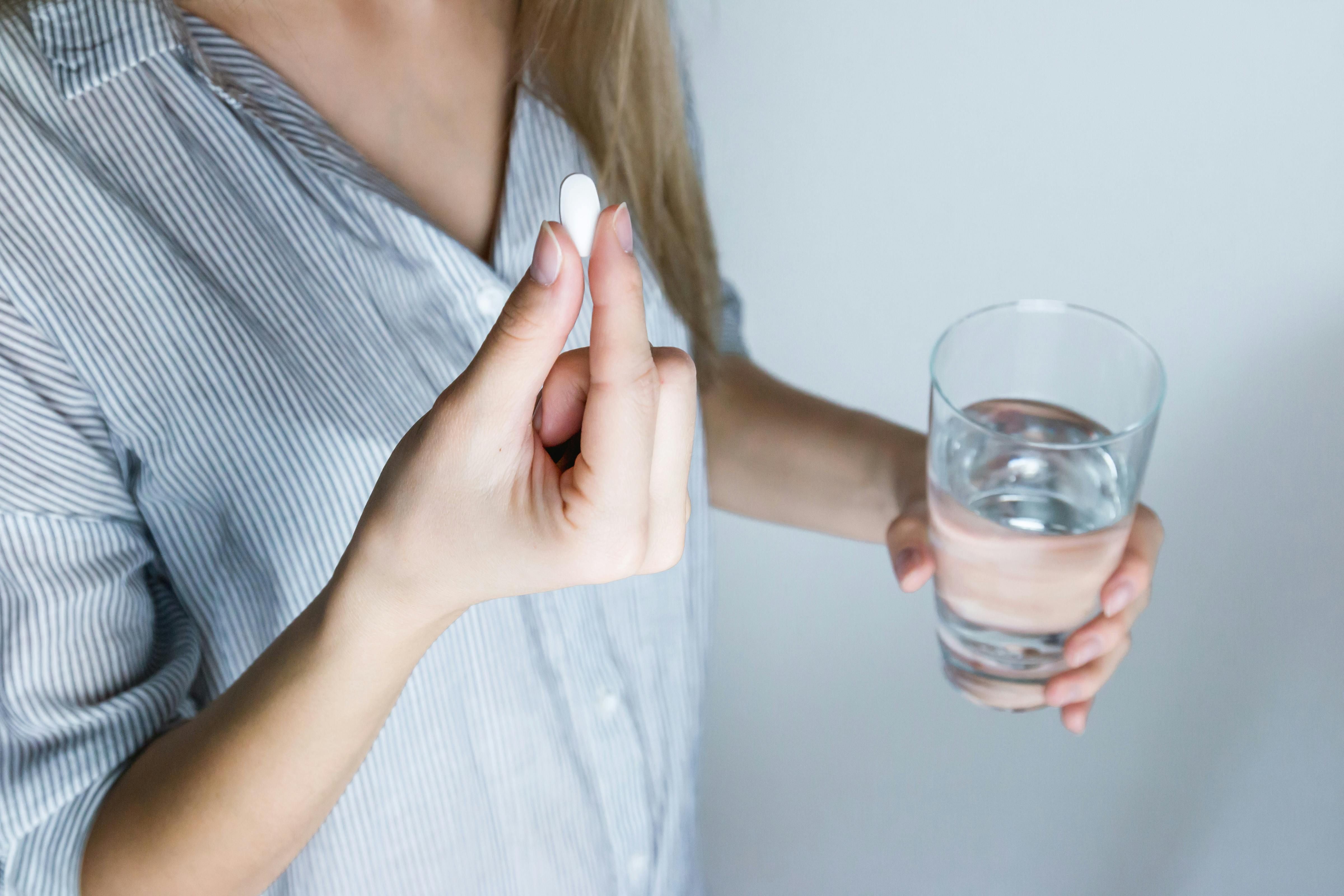 A woman taking an antipsychotic medication during her intermittent fasting window